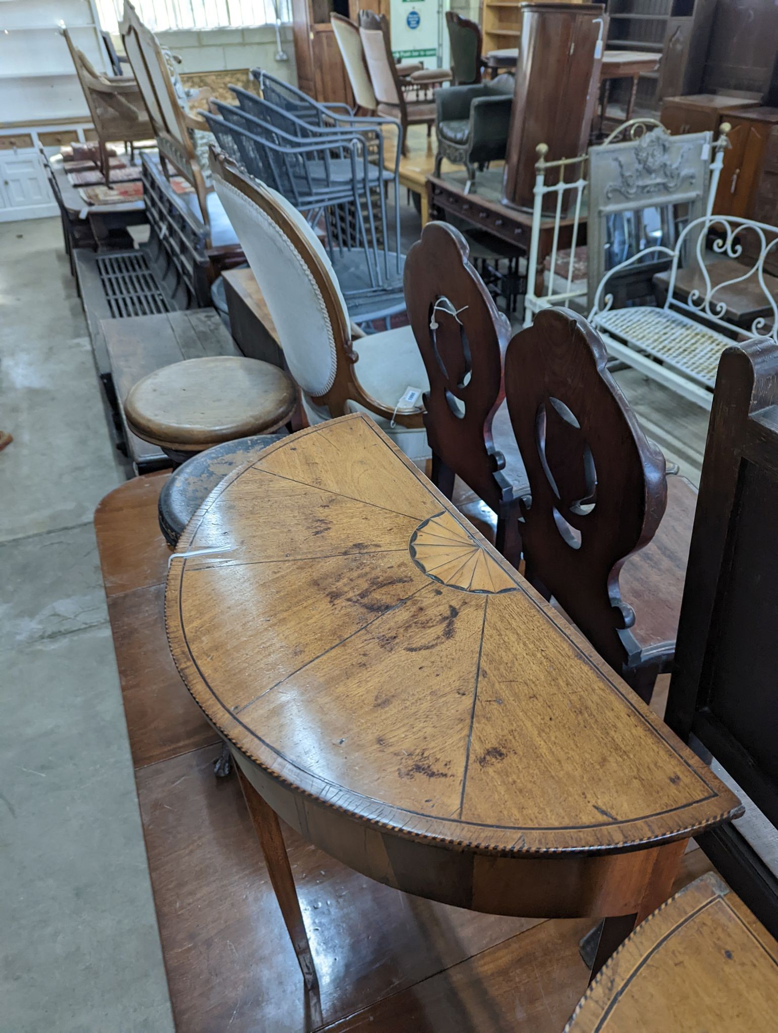 A pair of George III style inlaid mahogany D shaped side tables, width 64cm, depth 32cm, height 71cm